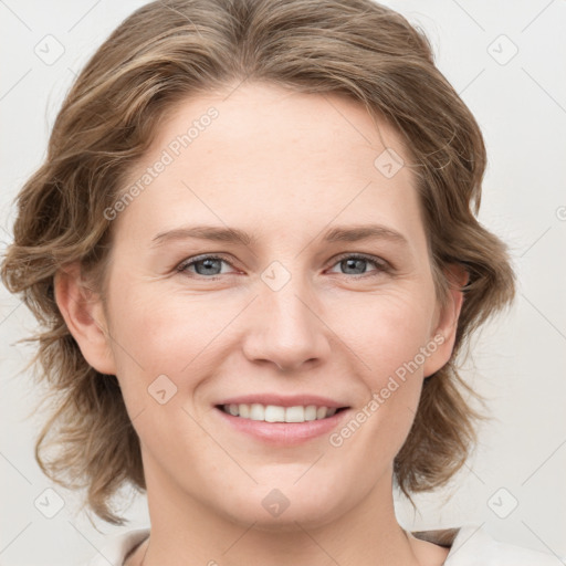 Joyful white young-adult female with medium  brown hair and blue eyes