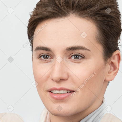 Joyful white young-adult female with short  brown hair and brown eyes