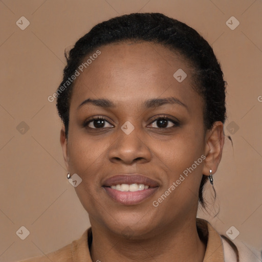 Joyful black young-adult female with short  brown hair and brown eyes
