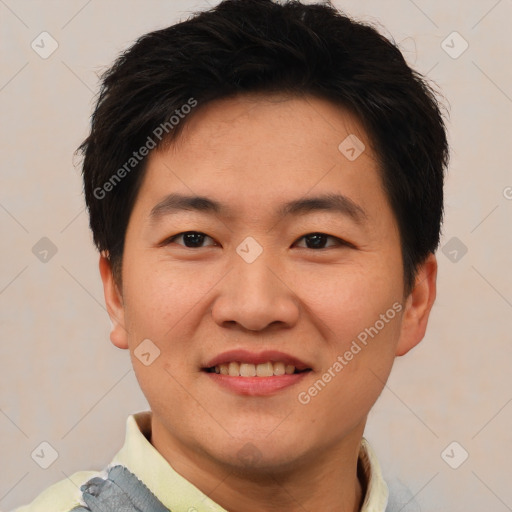 Joyful asian young-adult male with short  brown hair and brown eyes