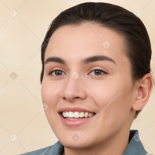 Joyful white young-adult female with short  brown hair and brown eyes