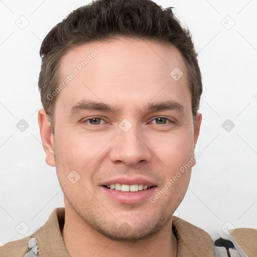 Joyful white young-adult male with short  brown hair and grey eyes