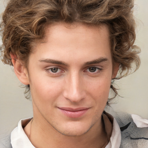 Joyful white young-adult male with medium  brown hair and brown eyes