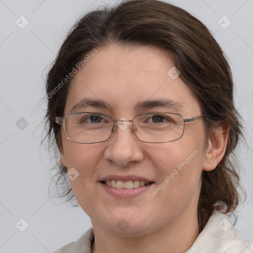 Joyful white adult female with medium  brown hair and brown eyes