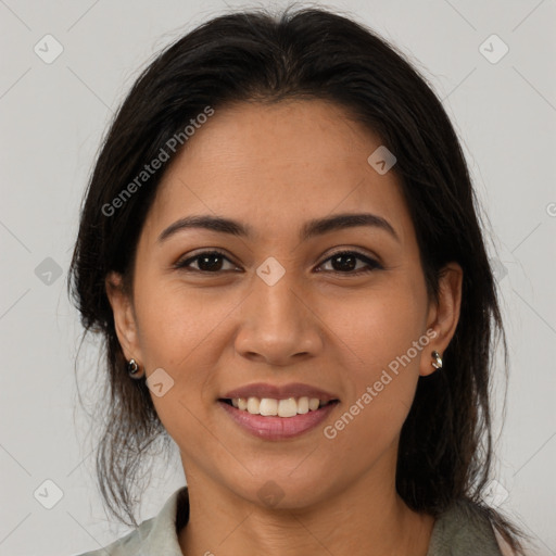 Joyful latino young-adult female with medium  brown hair and brown eyes