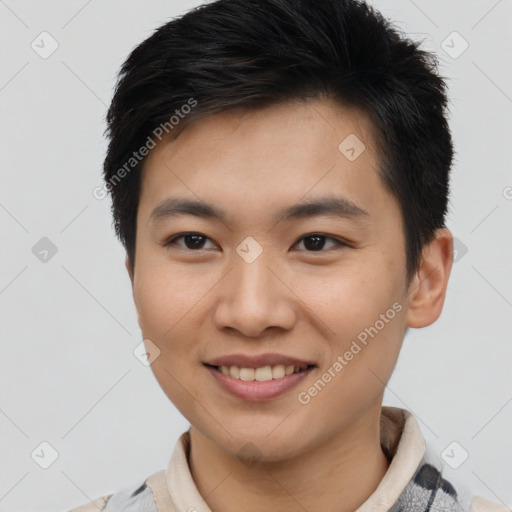 Joyful asian young-adult male with short  brown hair and brown eyes