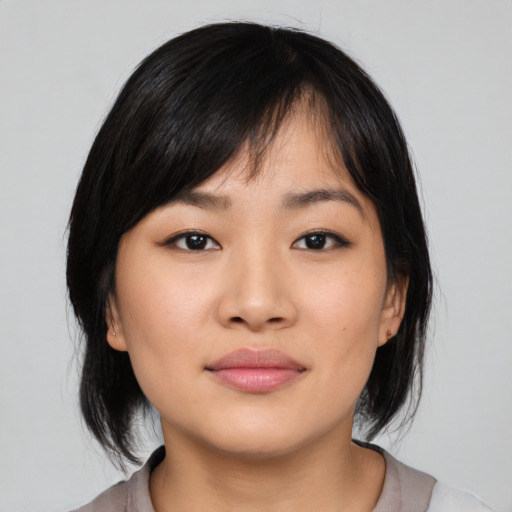 Neutral asian young-adult female with medium  black hair and brown eyes