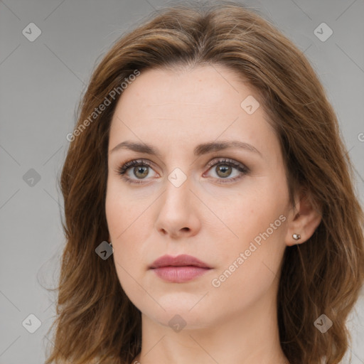 Neutral white young-adult female with long  brown hair and brown eyes