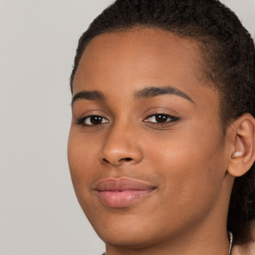 Joyful latino young-adult female with short  brown hair and brown eyes