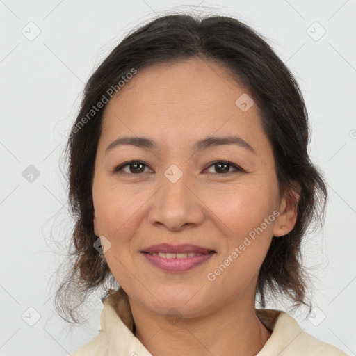 Joyful asian adult female with medium  brown hair and brown eyes