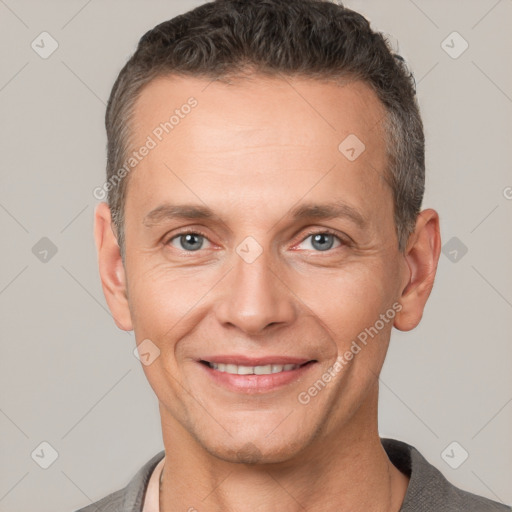 Joyful white adult male with short  brown hair and brown eyes