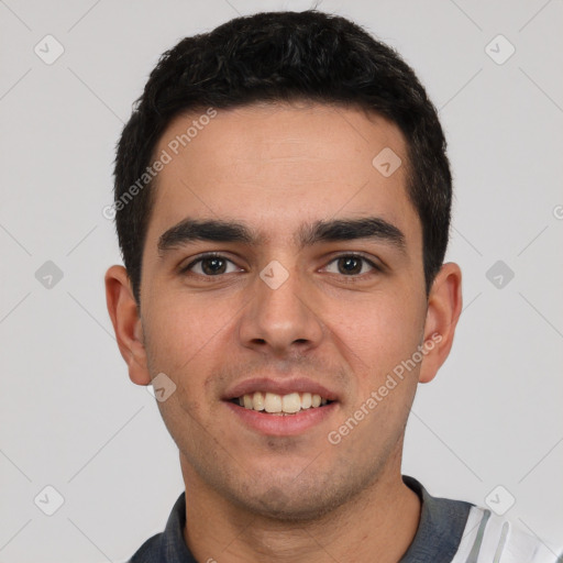 Joyful white young-adult male with short  black hair and brown eyes