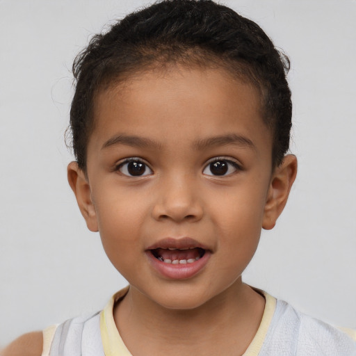 Joyful latino child female with short  brown hair and brown eyes