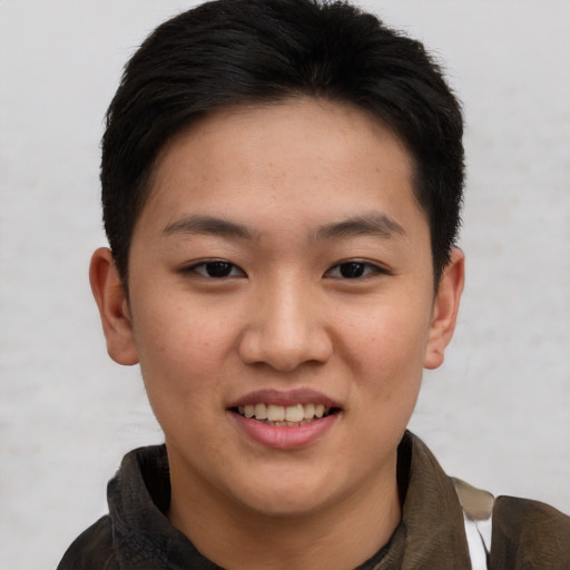 Joyful asian young-adult female with short  brown hair and brown eyes