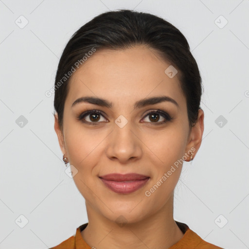 Joyful latino young-adult female with short  brown hair and brown eyes