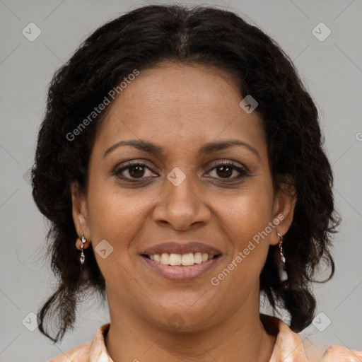 Joyful black adult female with medium  brown hair and brown eyes