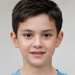 Joyful white child male with short  brown hair and brown eyes