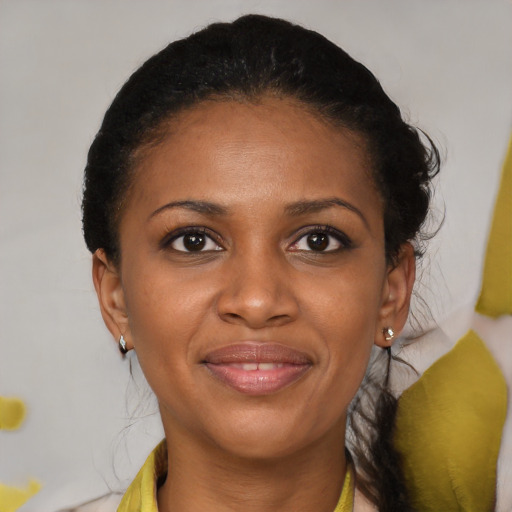 Joyful black young-adult female with medium  brown hair and brown eyes