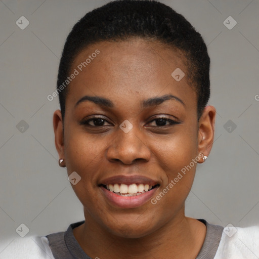 Joyful black young-adult female with short  black hair and brown eyes