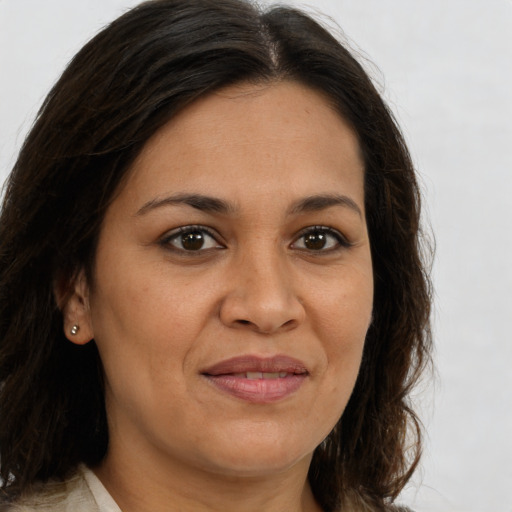 Joyful white adult female with long  brown hair and brown eyes