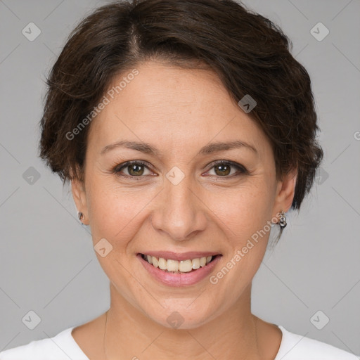 Joyful white adult female with short  brown hair and brown eyes