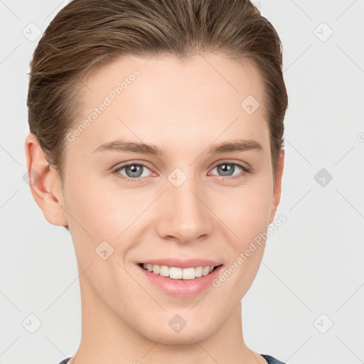 Joyful white young-adult female with short  brown hair and grey eyes