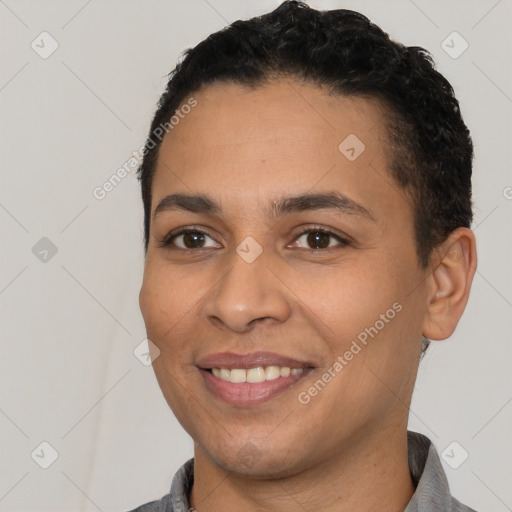 Joyful latino young-adult female with short  black hair and brown eyes