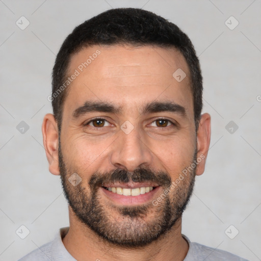 Joyful white young-adult male with short  black hair and brown eyes