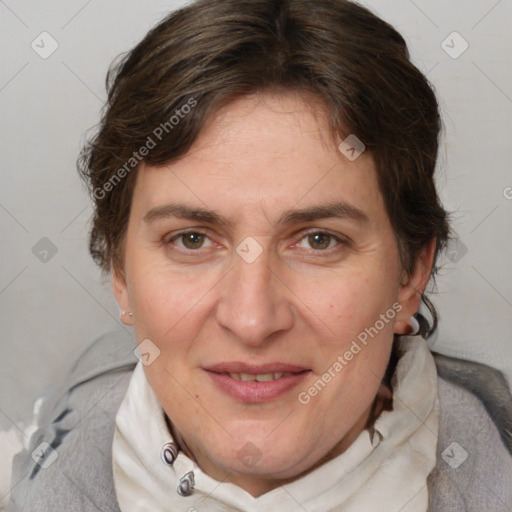 Joyful white adult female with medium  brown hair and blue eyes