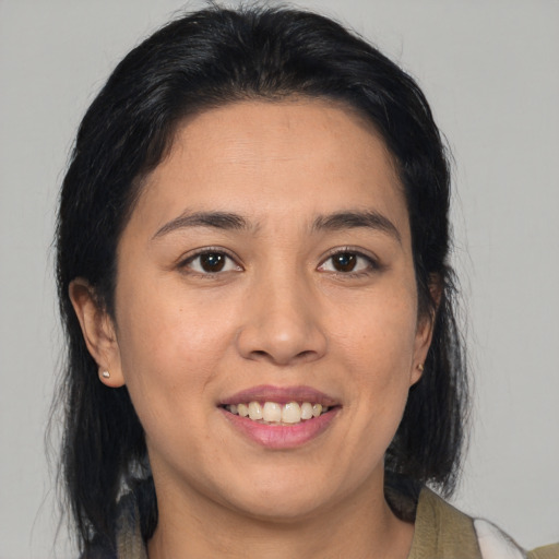 Joyful asian young-adult female with medium  brown hair and brown eyes