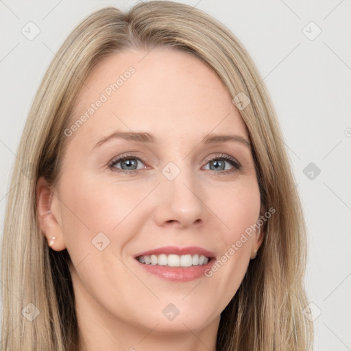 Joyful white young-adult female with long  brown hair and blue eyes