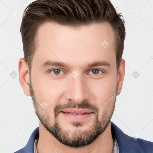 Joyful white young-adult male with short  brown hair and grey eyes