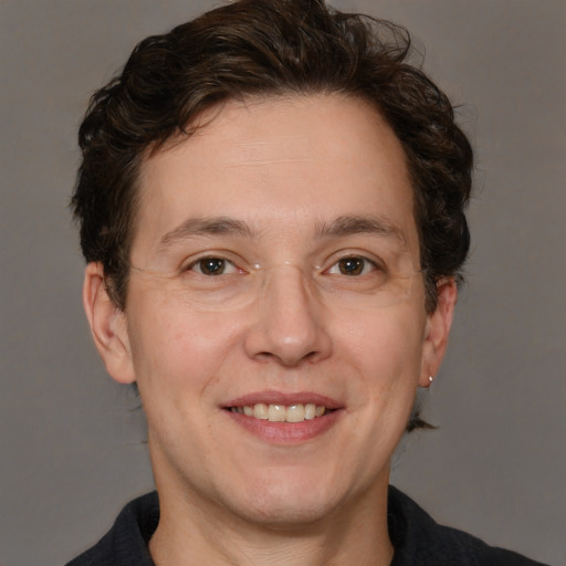 Joyful white adult male with medium  brown hair and brown eyes