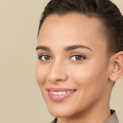 Joyful white young-adult female with short  brown hair and brown eyes