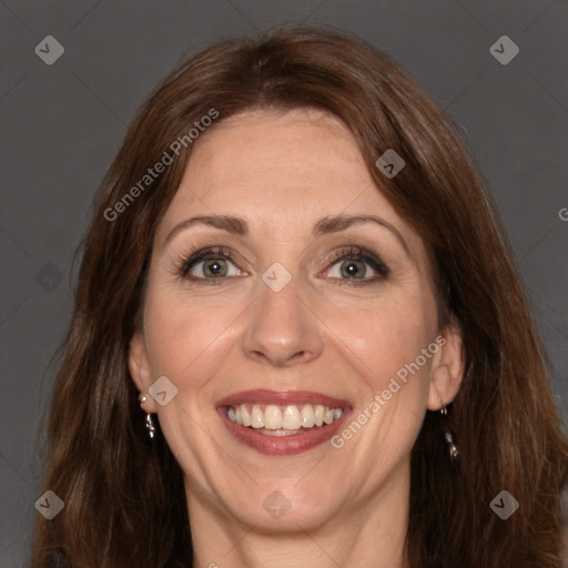 Joyful white adult female with long  brown hair and brown eyes