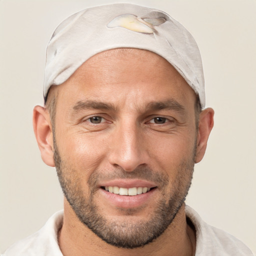 Joyful white adult male with short  brown hair and brown eyes