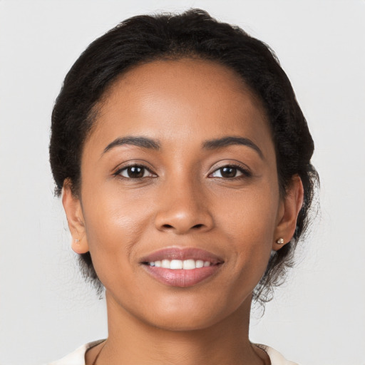 Joyful latino young-adult female with short  brown hair and brown eyes