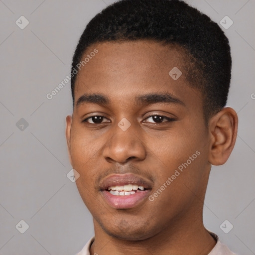 Joyful black young-adult male with short  black hair and brown eyes