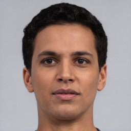 Neutral latino young-adult male with short  black hair and brown eyes