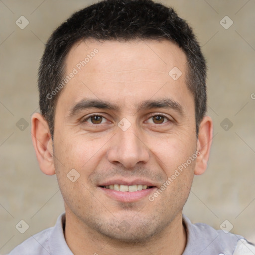 Joyful white adult male with short  brown hair and brown eyes