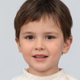 Joyful white child male with short  brown hair and brown eyes