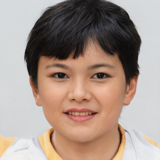 Joyful asian child female with short  brown hair and brown eyes