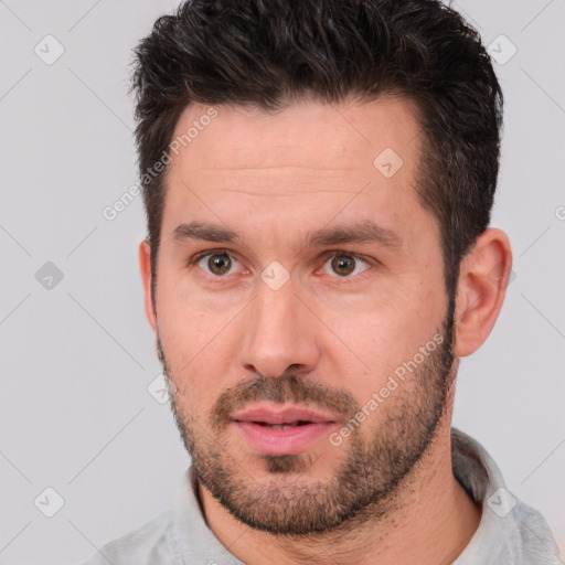 Neutral white young-adult male with short  brown hair and brown eyes