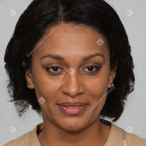 Joyful black adult female with medium  brown hair and brown eyes