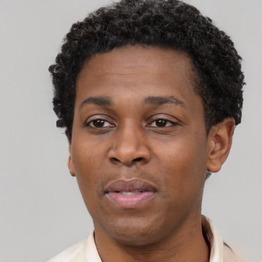 Neutral black adult male with short  black hair and brown eyes