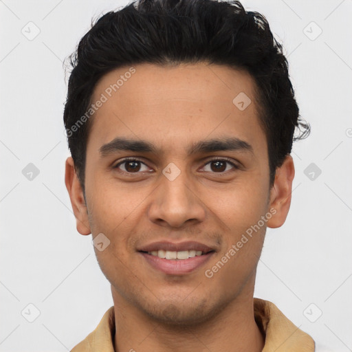 Joyful latino young-adult male with short  brown hair and brown eyes