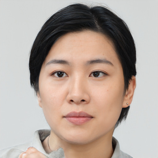 Neutral asian young-adult female with medium  black hair and brown eyes