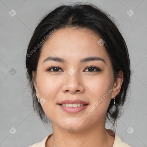 Joyful asian young-adult female with medium  brown hair and brown eyes