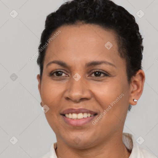 Joyful latino young-adult female with short  brown hair and brown eyes