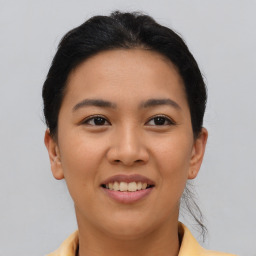 Joyful asian young-adult female with short  brown hair and brown eyes